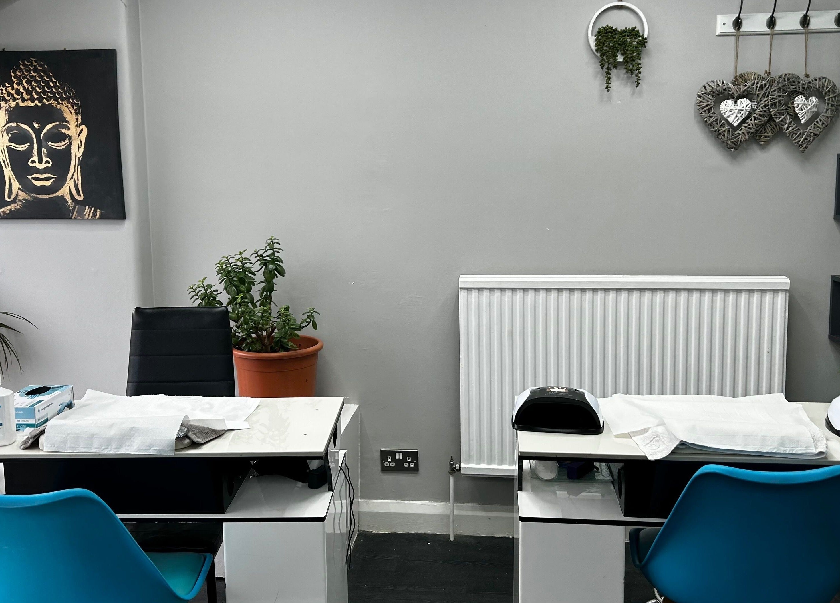 Tranquil nail station at Hands of Buddha, Sale, England, GB, featuring calm decor and Buddha art.