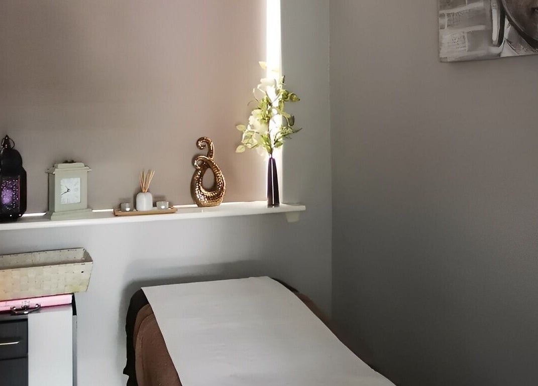 Calm treatment room at Hands of Buddha, Sale, England, GB with serene decor and soft lighting.