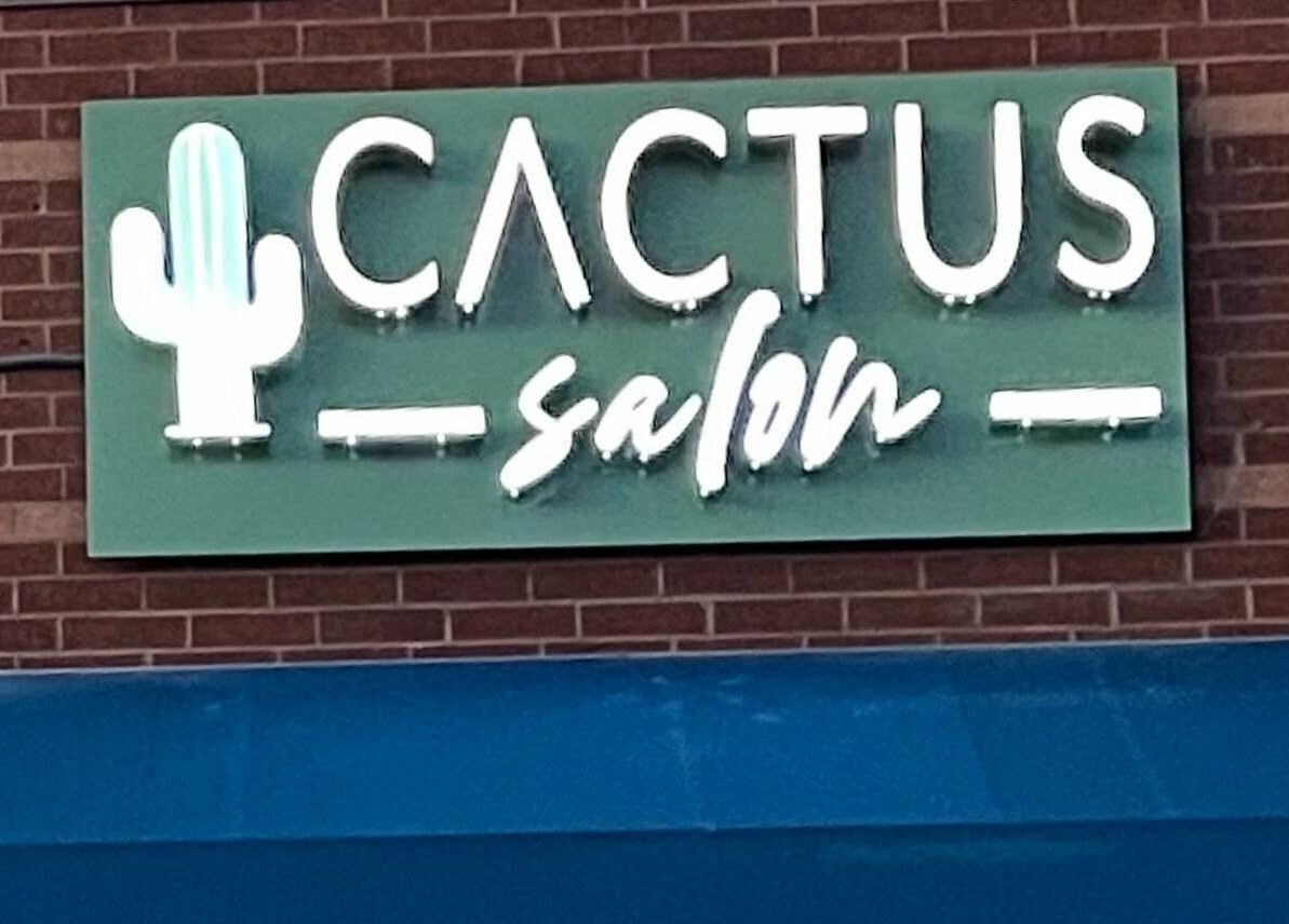 Cactus Salon signage glowing in neon, located in Addison, Texas, US.