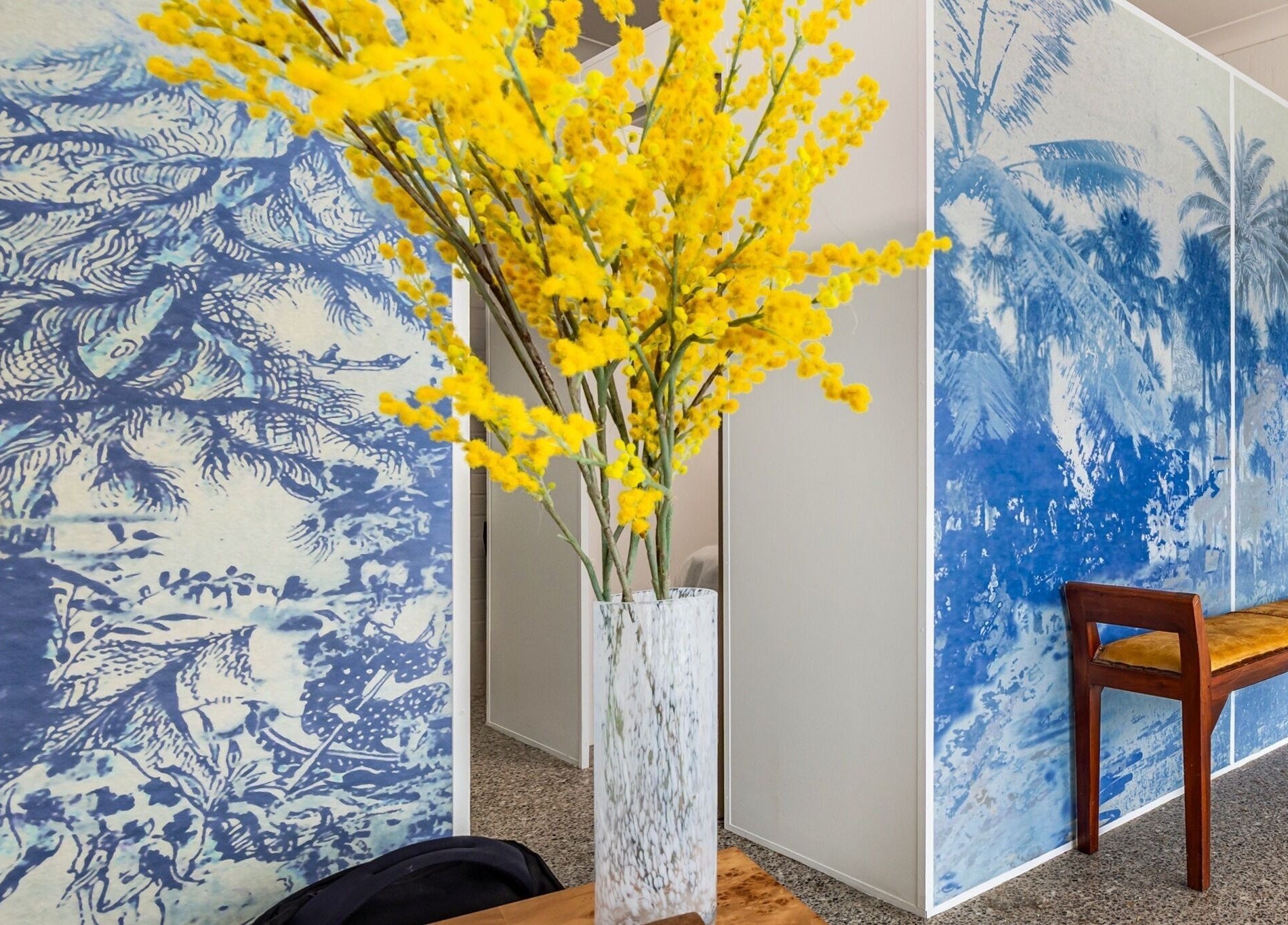 Bright yellow flowers and tropical-themed decor at Bare Beauty Clinic Sydney, NSW, AU.