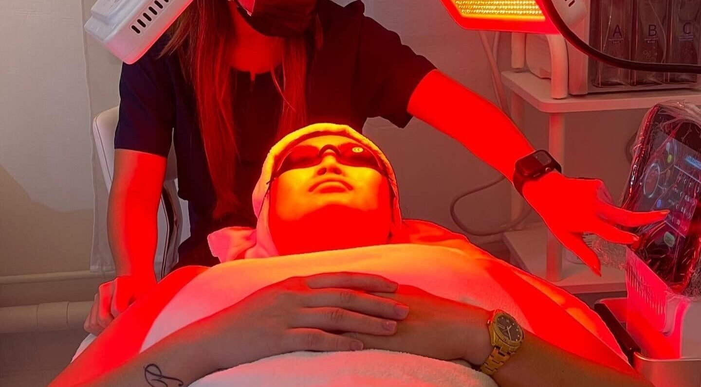 Relaxing LED facial treatment at SP Beauty Bar, Sydney, New South Wales, AU under dynamic red light therapy.