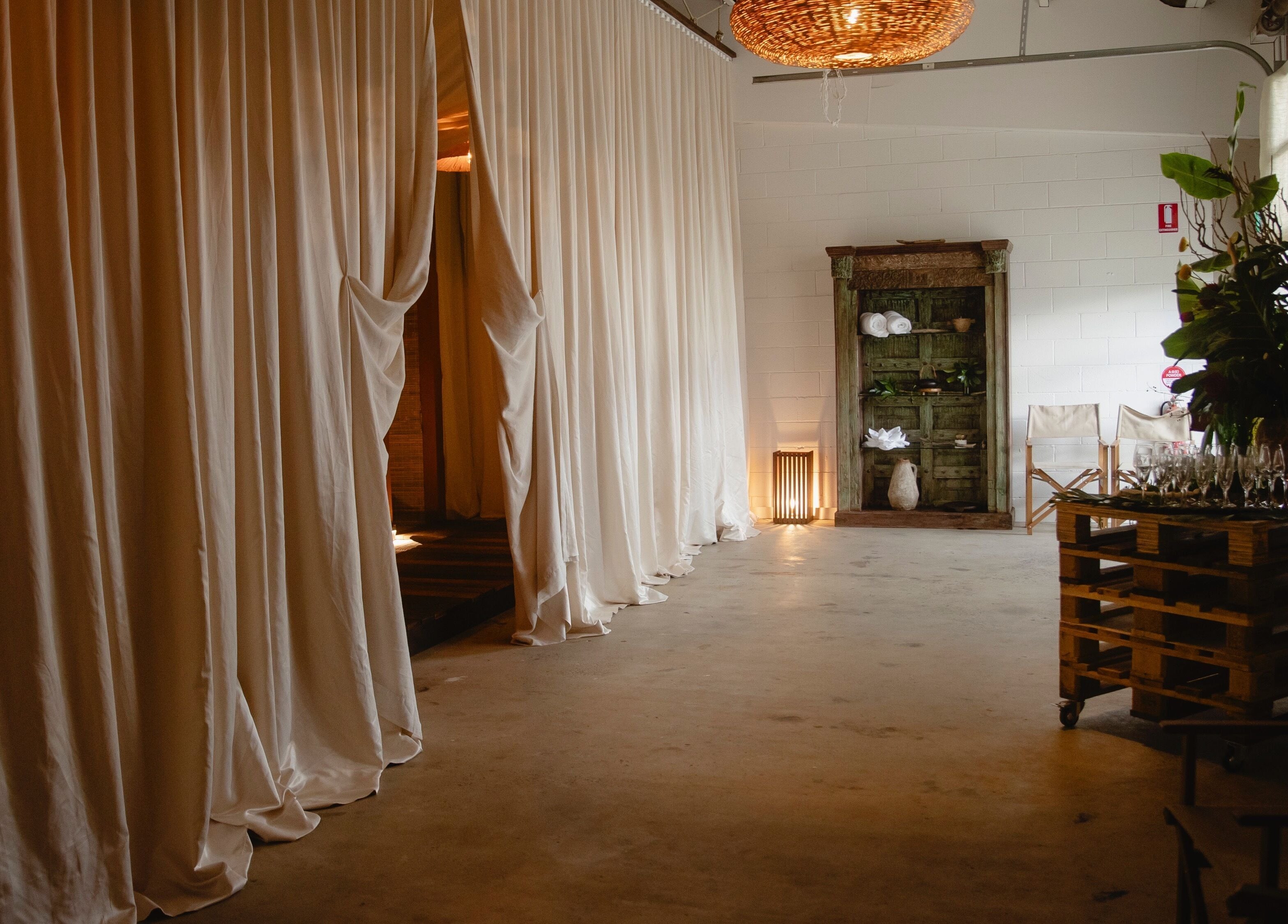 Elegant interior of Kondōu in Kincumber, New South Wales, AU with flowing white curtains and serene decor.