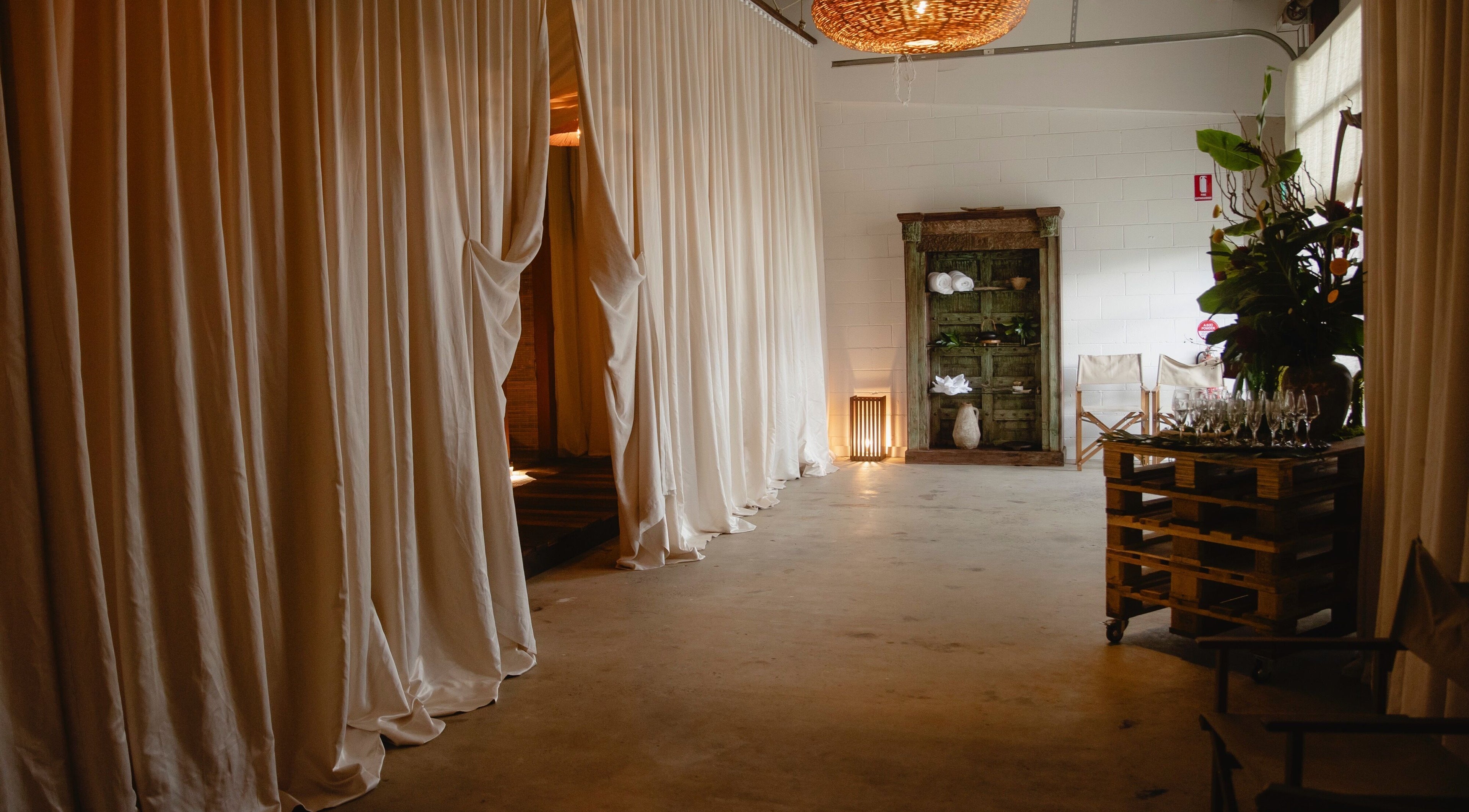Elegant interior of Kondōu in Kincumber, New South Wales, AU with flowing white curtains and serene decor.