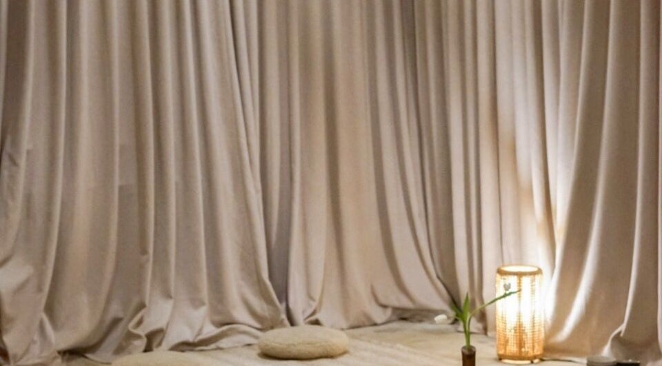 Peaceful meditation setup at Kondōu in Kincumber, New South Wales, AU. Soft lighting and cushions for relaxation.