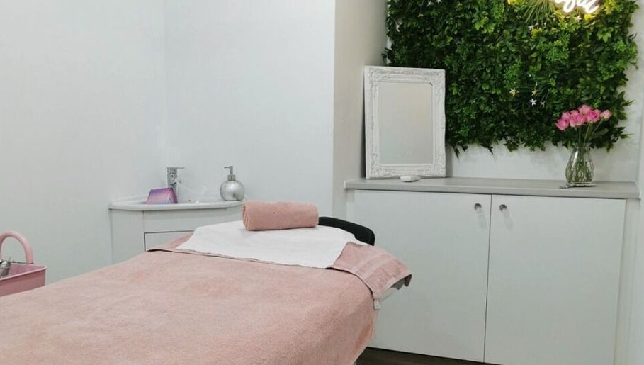 Tranquil treatment room at Eden Beauty House in Ipswich, England, GB features cozy decor and soothing ambiance.