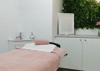 Tranquil treatment room at Eden Beauty House in Ipswich, England, GB features cozy decor and soothing ambiance.