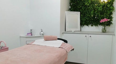 Tranquil treatment room at Eden Beauty House in Ipswich, England, GB features cozy decor and soothing ambiance.