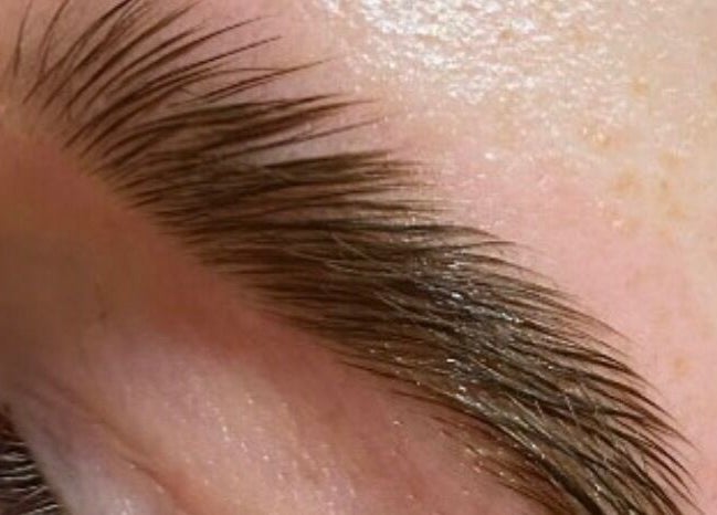 Expertly shaped eyebrow at Hers & Sirs, Manchester, England, GB, showcasing precise grooming.