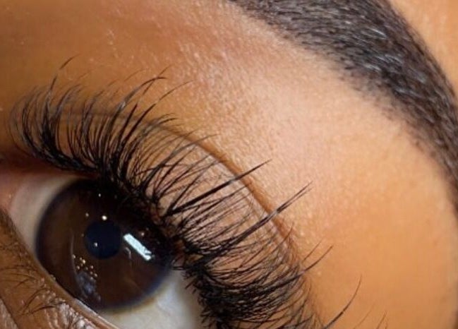 Close-up of a perfectly shaped eyebrow and lashes at Hers & Sirs, Manchester, England, GB.