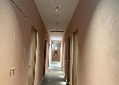 Elegant hallway of Ocean Day Spa in Surfers Paradise, Queensland, AU with soft lighting and calming ambiance.