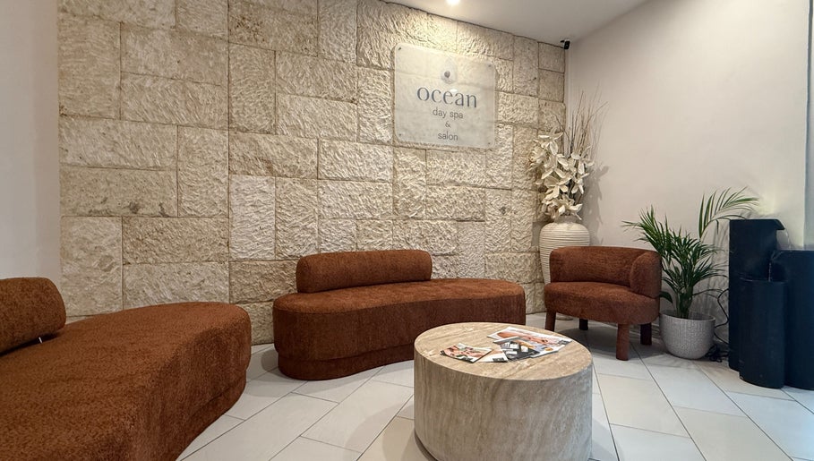 Elegant lobby at Ocean Day Spa in Surfers Paradise, Queensland, AU with cozy seating and ambient decor.