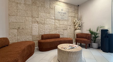 Elegant lobby at Ocean Day Spa in Surfers Paradise, Queensland, AU with cozy seating and ambient decor.