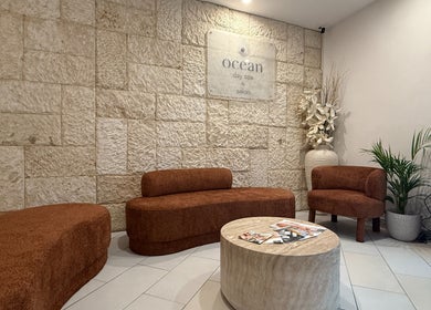 Cozy seating area at OCEAN Day Spa, Surfers Paradise, Queensland, AU with elegant decor.