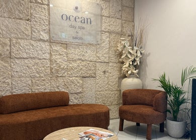 Cozy seating area at OCEAN Day Spa, Surfers Paradise, Queensland, AU with warm decor and relaxing ambiance.