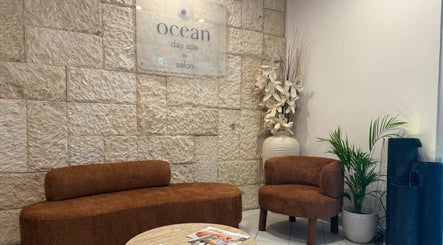 Cozy seating area at OCEAN Day Spa, Surfers Paradise, Queensland, AU with warm decor and relaxing ambiance.