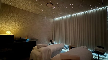 Tranquil treatment room at OCEAN Day Spa, Surfers Paradise, Queensland, AU with calming lighting and massage beds.