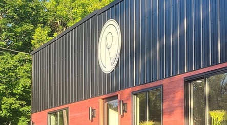 Front view of Gemini Skin + Lash Studio's sleek exterior in Winthrop, Maine, US.