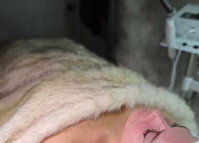 Client enjoys a serene facial treatment at Gemini Skin + Lash Studio, Winthrop, Maine, US.
