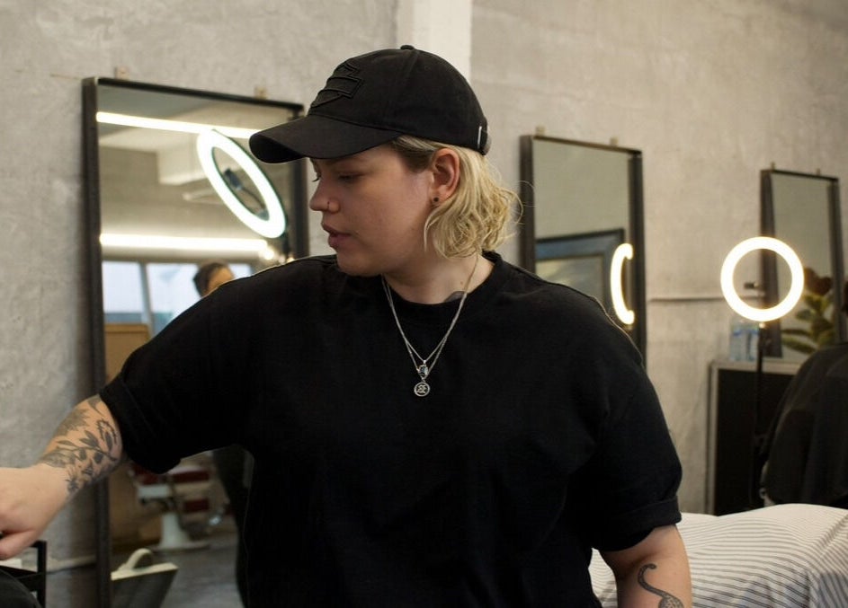 Hair stylist working at Onyx Studio, Melbourne, Victoria, AU, in a modern, chic salon setting.