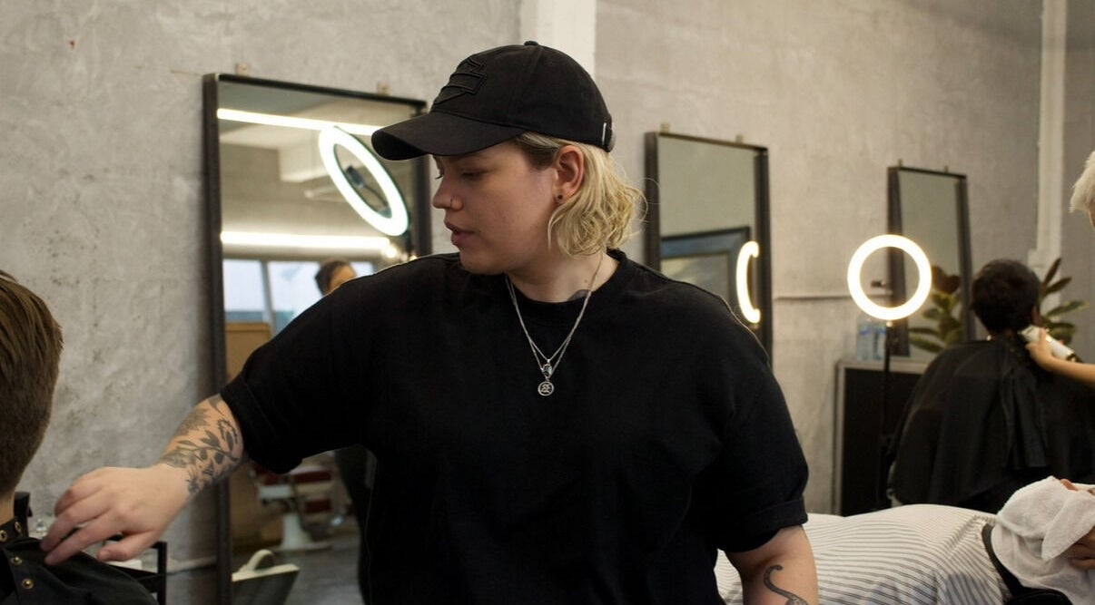 Hair stylist working at Onyx Studio, Melbourne, Victoria, AU, in a modern, chic salon setting.