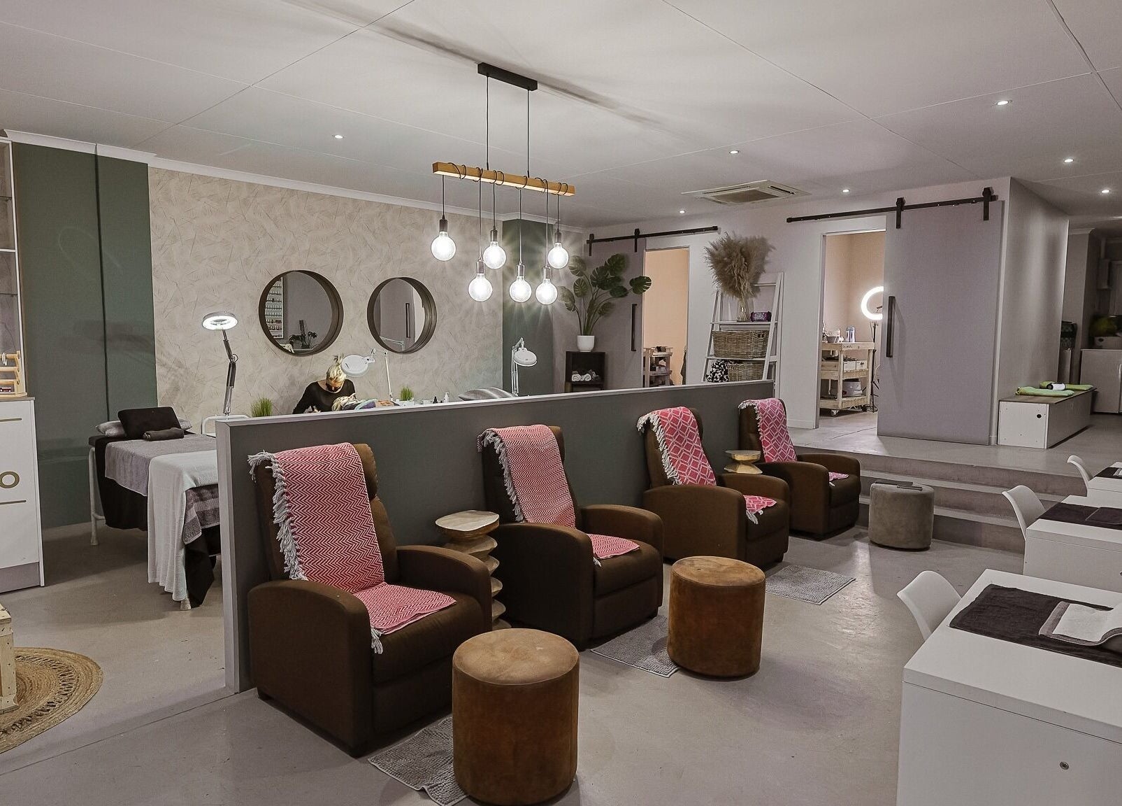 Modern beauty salon interior at Face by Design, Fourways, Gauteng, ZA showcasing relaxing seating and chic decor.