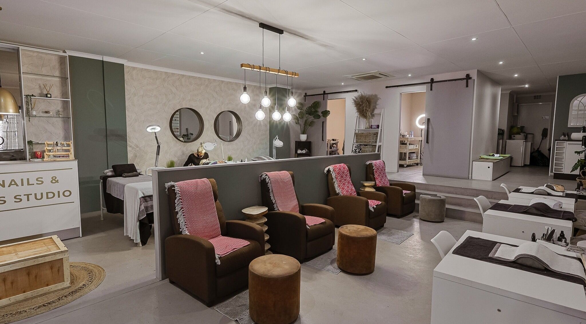 Modern beauty salon interior at Face by Design, Fourways, Gauteng, ZA showcasing relaxing seating and chic decor.