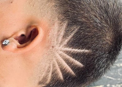 Close-up of artistic shaved design at Barberoni Barber², Iż-żurrieq, MT, showcasing unique barber skills.