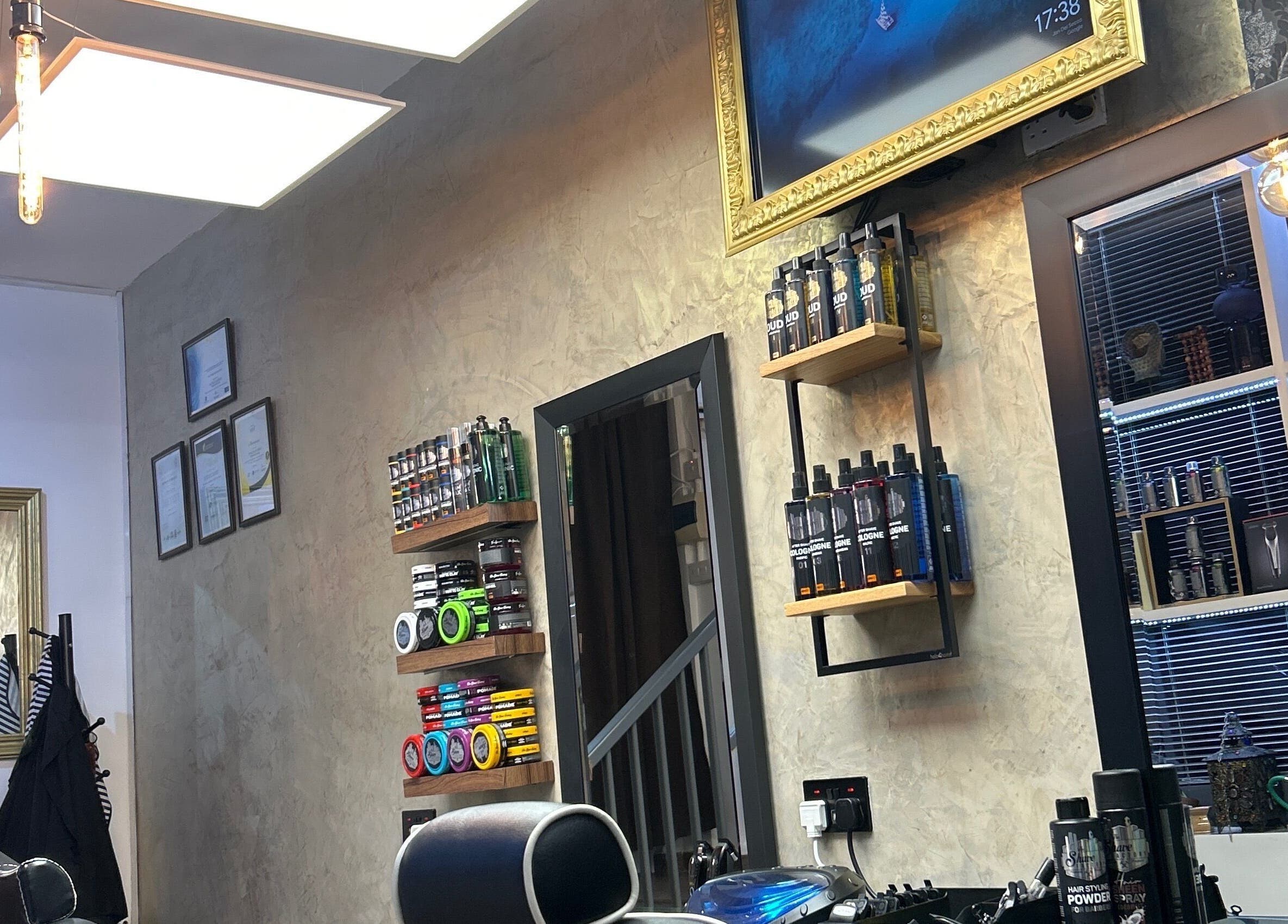 Modern interior of Barberoni Barber² in Iż-żurrieq, MT, featuring sleek shelves with grooming products.