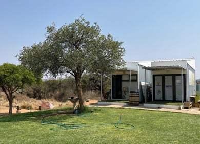 Exterior view of Precious Pearl Health and Skin Care in Windhoek, Khomas Region, NA surrounded by lush greenery.