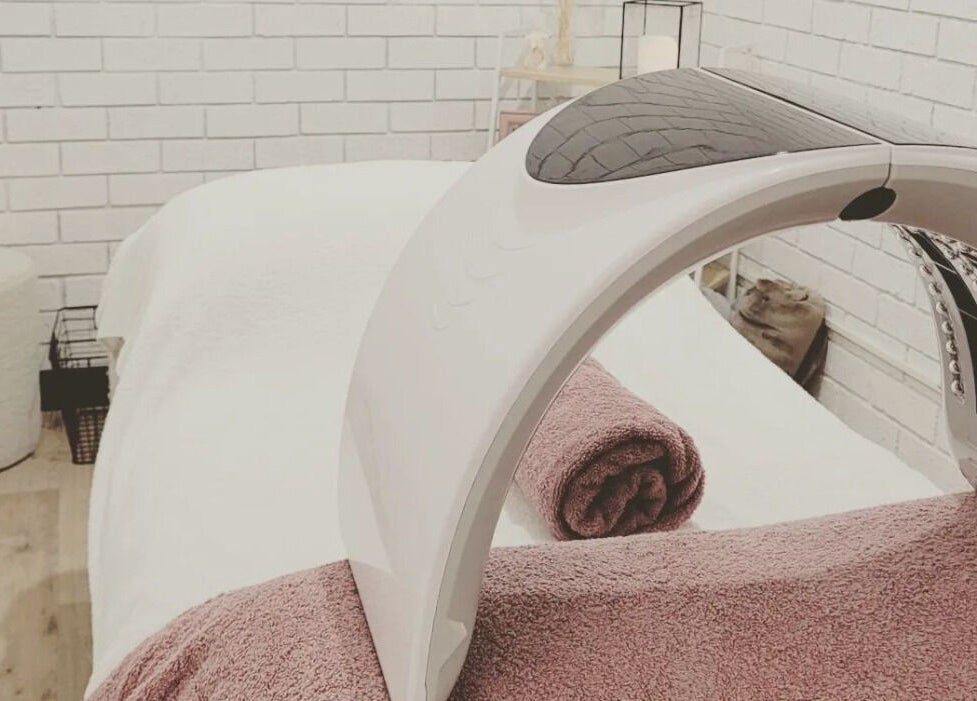 Relaxing treatment room at Dluxe Beauty and Brows, Waratah, New South Wales, AU, featuring a modern LED therapy machine.