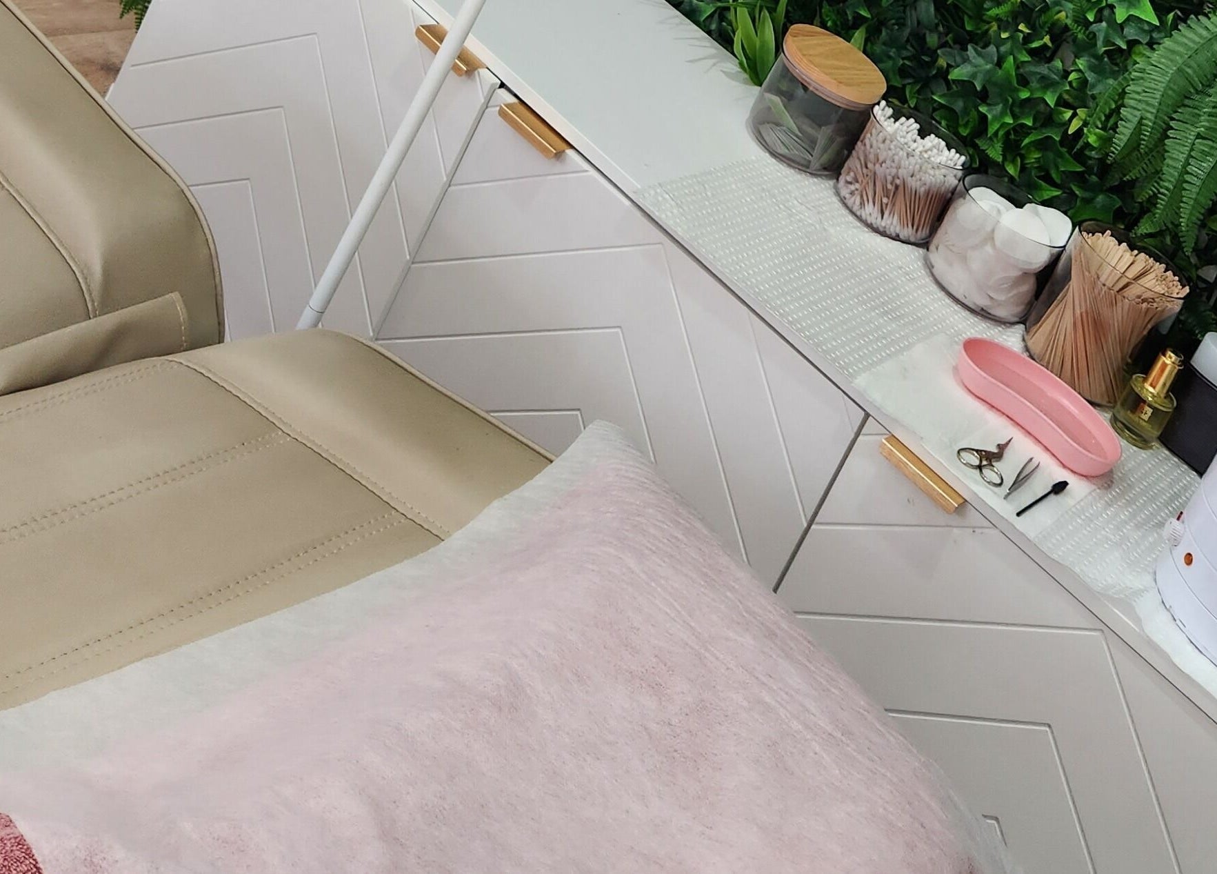 Luxurious treatment area at Dluxe Beauty and Brows in Waratah, New South Wales, AU with tools and greenery.