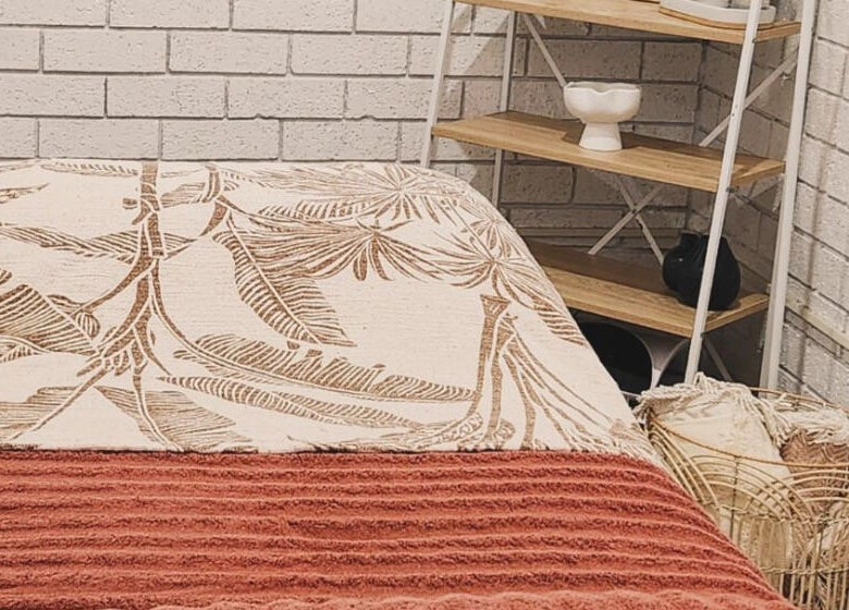 Relaxing treatment room at Dluxe Beauty and Brows in Waratah, New South Wales, AU with cozy decor.