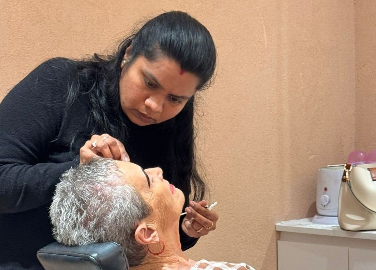 Stylist shaping eyebrows at Beauty Hub - Carindale, Carindale, Queensland, AU.