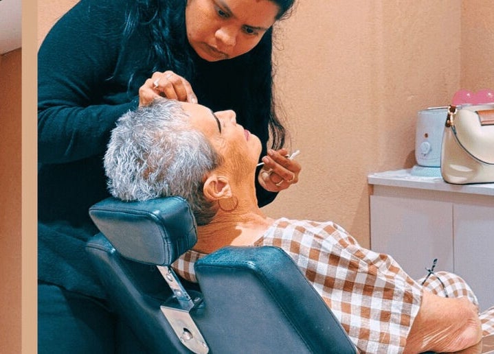 Elderly woman enjoying a beauty session at Beauty Hub - Carindale, located in Carindale, Queensland, AU.