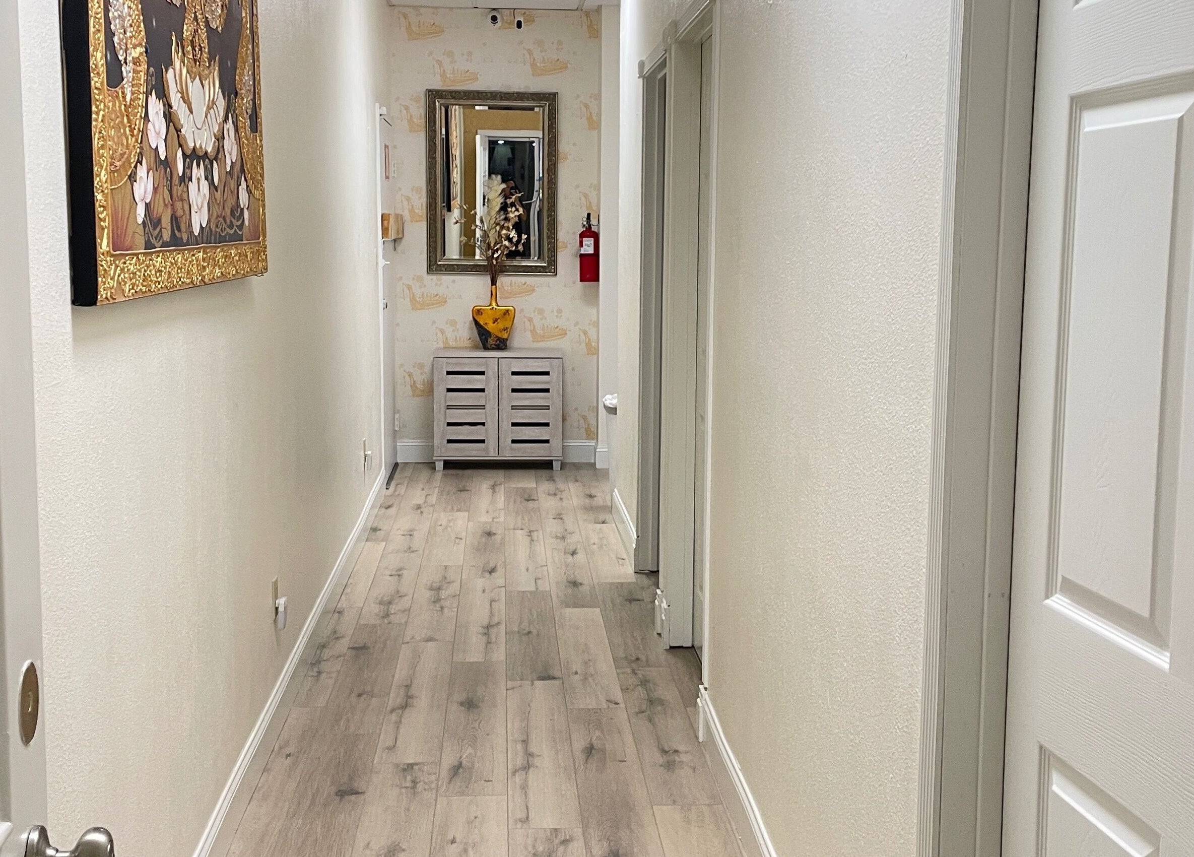 Elegant hallway at Kinnaree Thai Spa in Fresno, California, US features Thai decor and soothing ambiance.