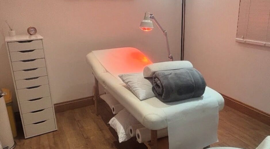Massage table with warm lighting at The Beauty in you at The Little Health Barn, Leatherhead, England, GB.