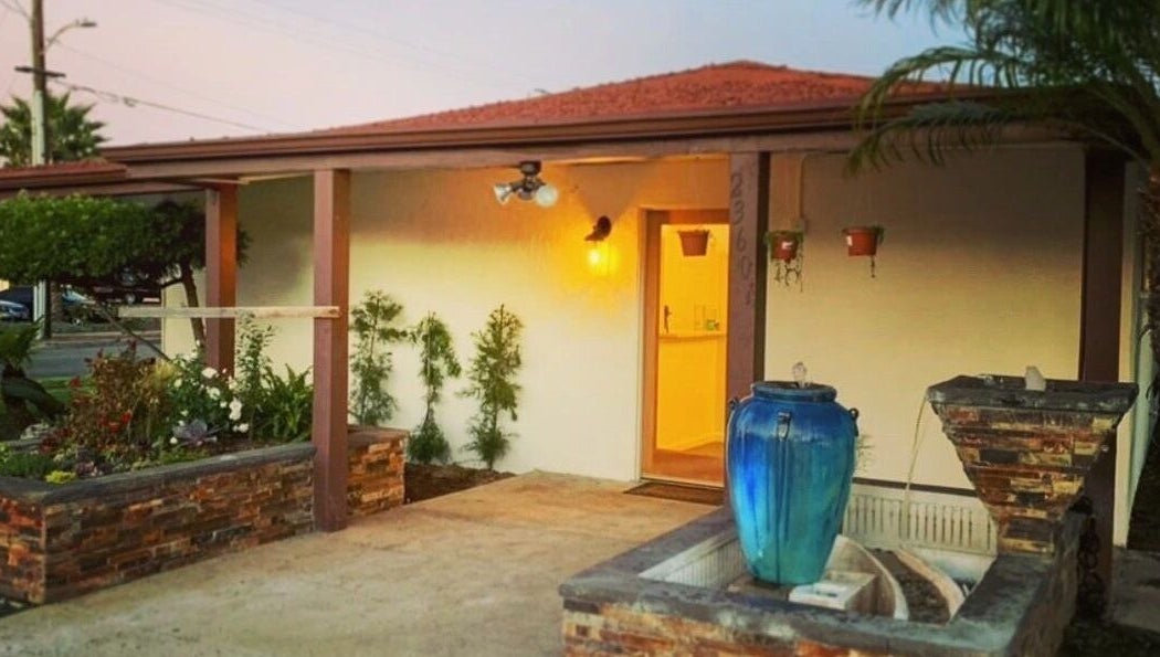 SIAM WALA Serenity Spa entrance with elegant fountain in Torrance, California, US, at dusk.