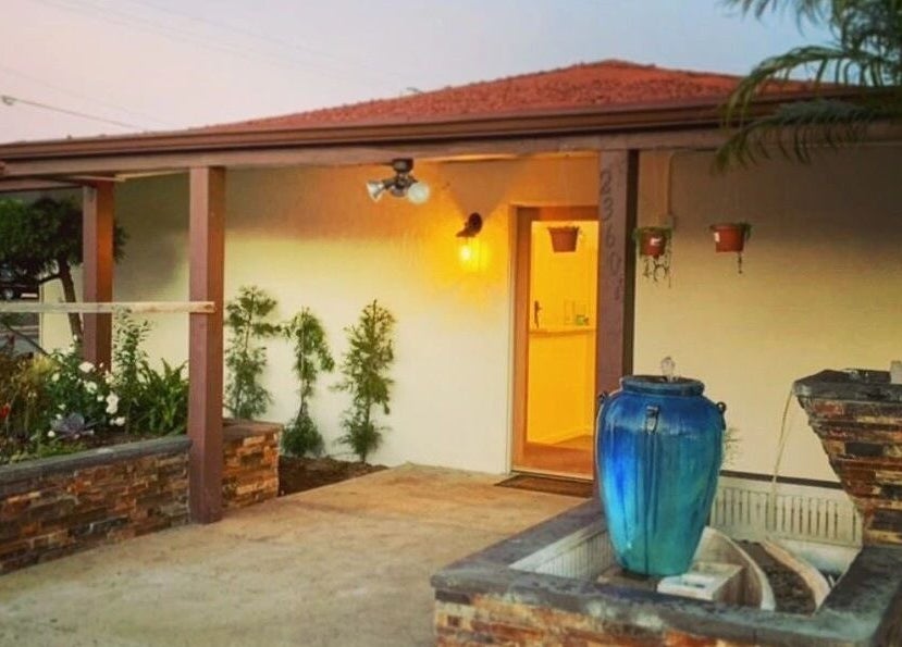 SIAM WALA Serenity Spa entrance with elegant fountain in Torrance, California, US, at dusk.