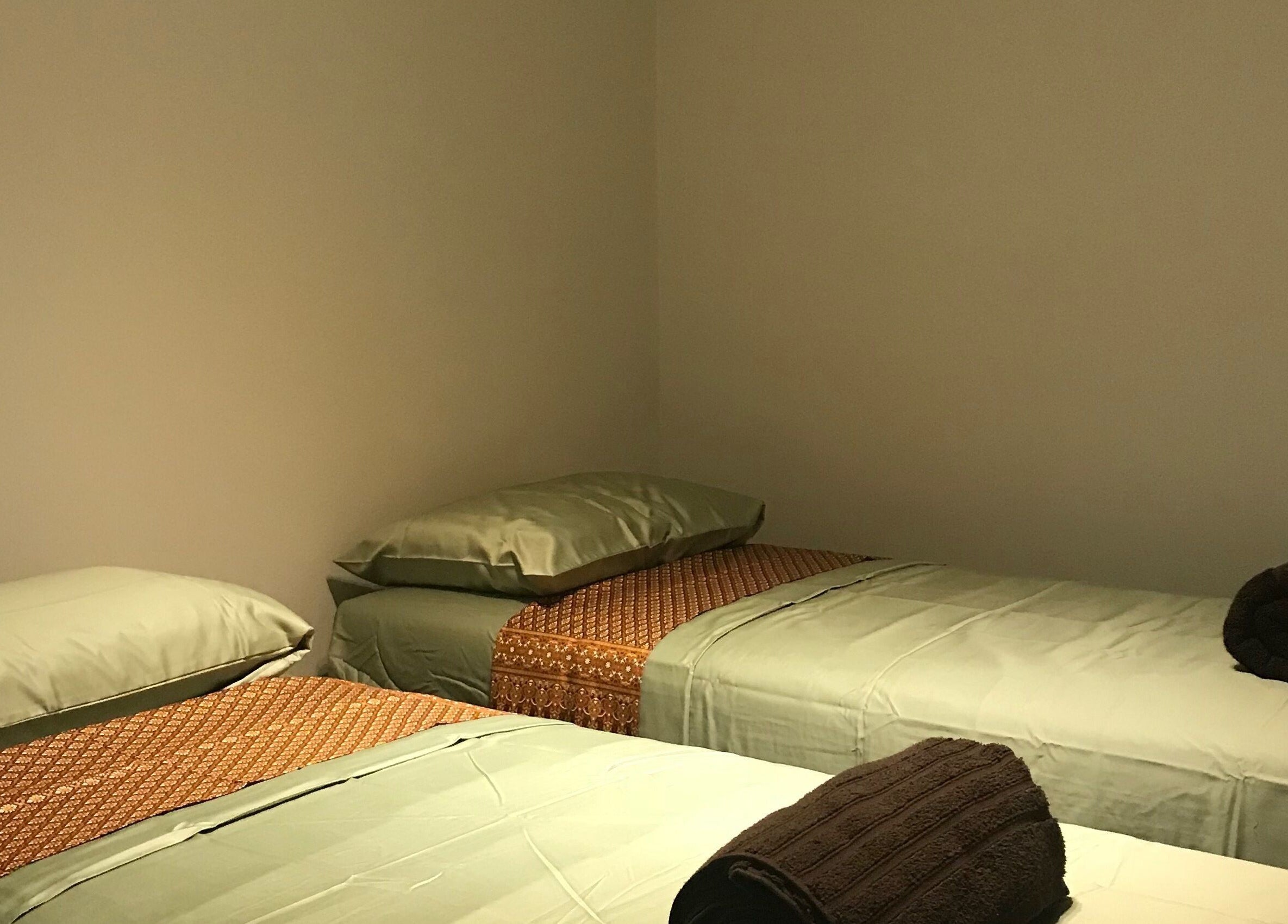 Relaxing twin beds at SIAM WALA Serenity Spa, Torrance, California, US, set for a calming wellness session.