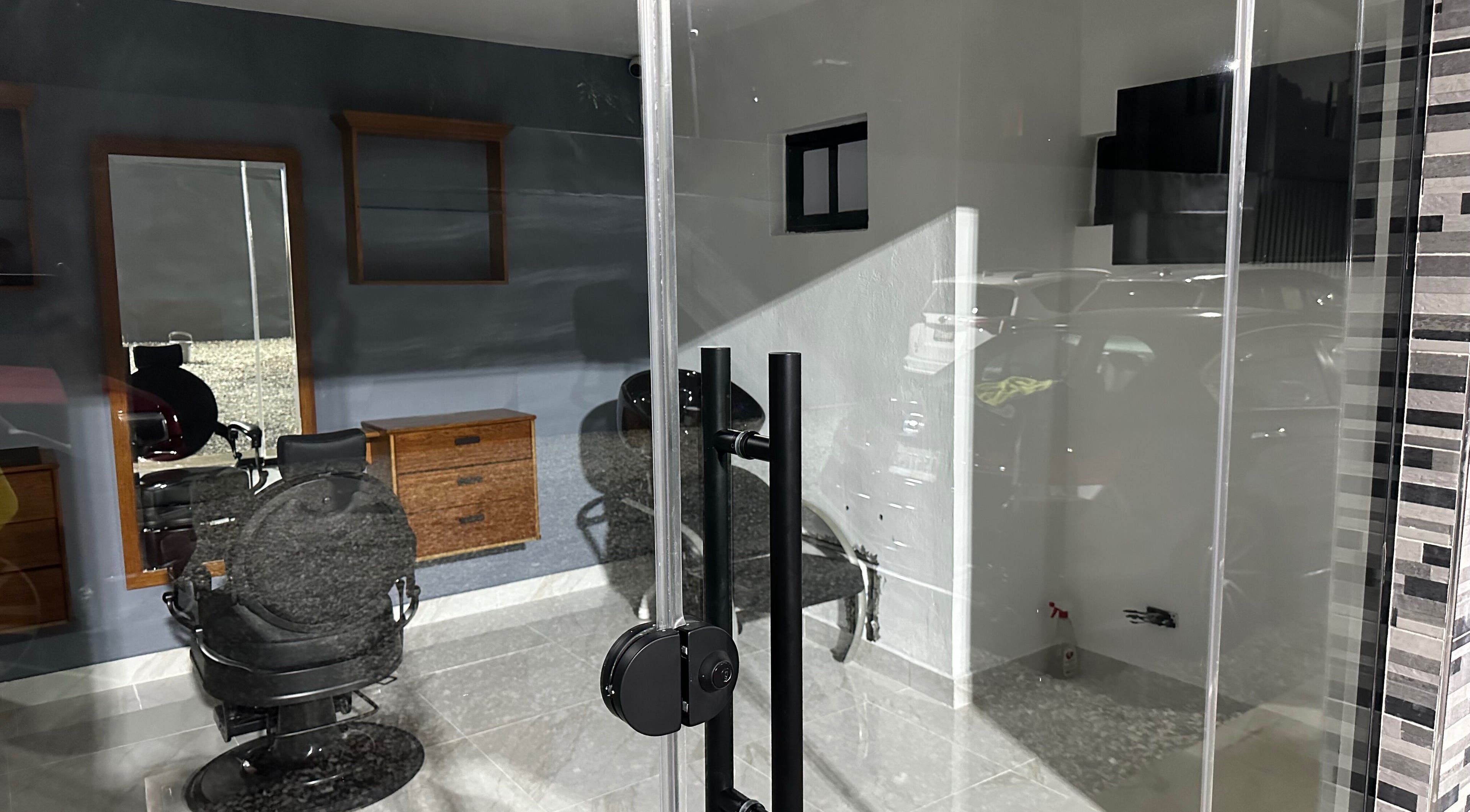 Modern barber chair and styling station at GBS Exclusive Barber, Santo Domingo Este, Santo Domingo, DO.