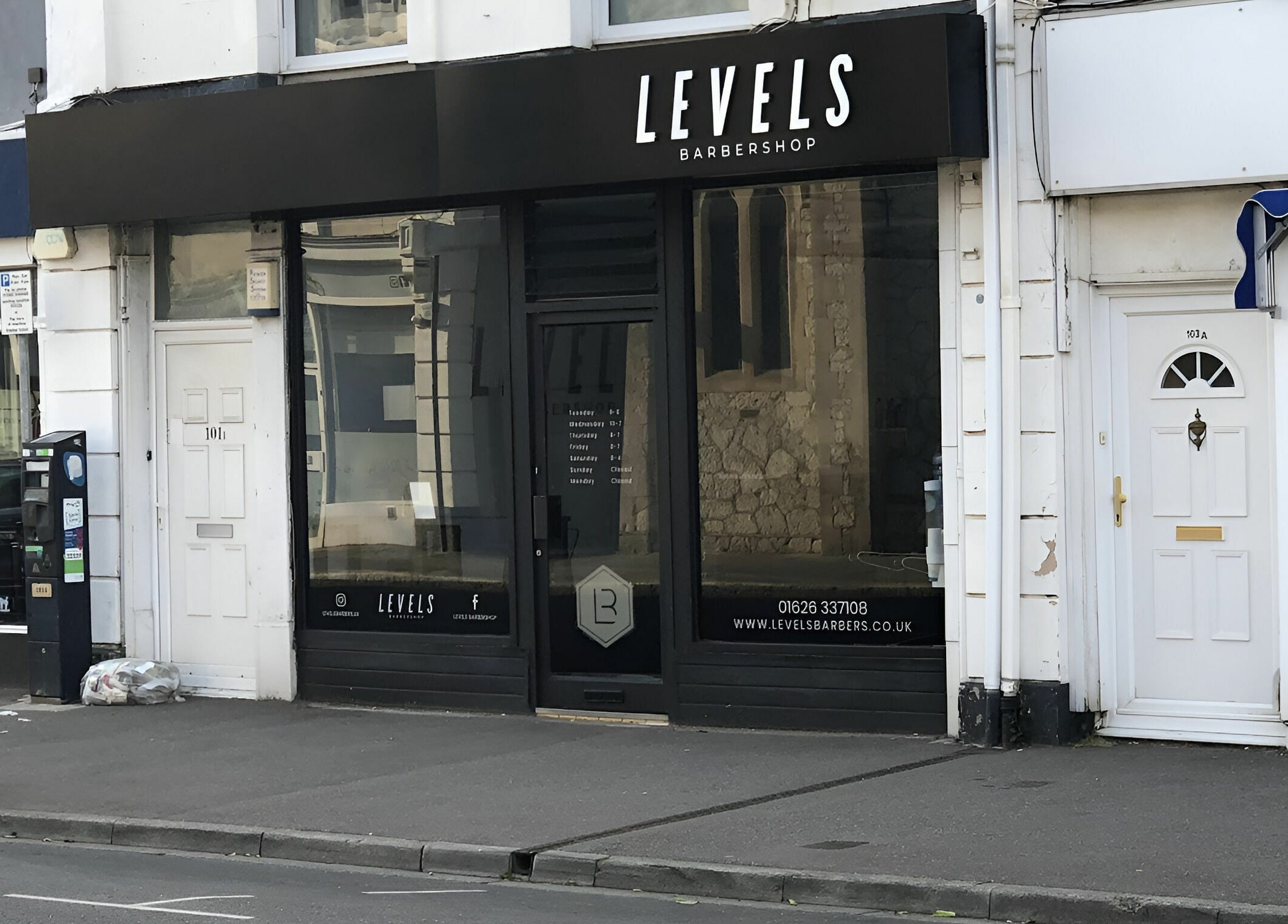 Front view of Levels Mens Grooming in Newton Abbot, England, GB showing modern barbershop facade.