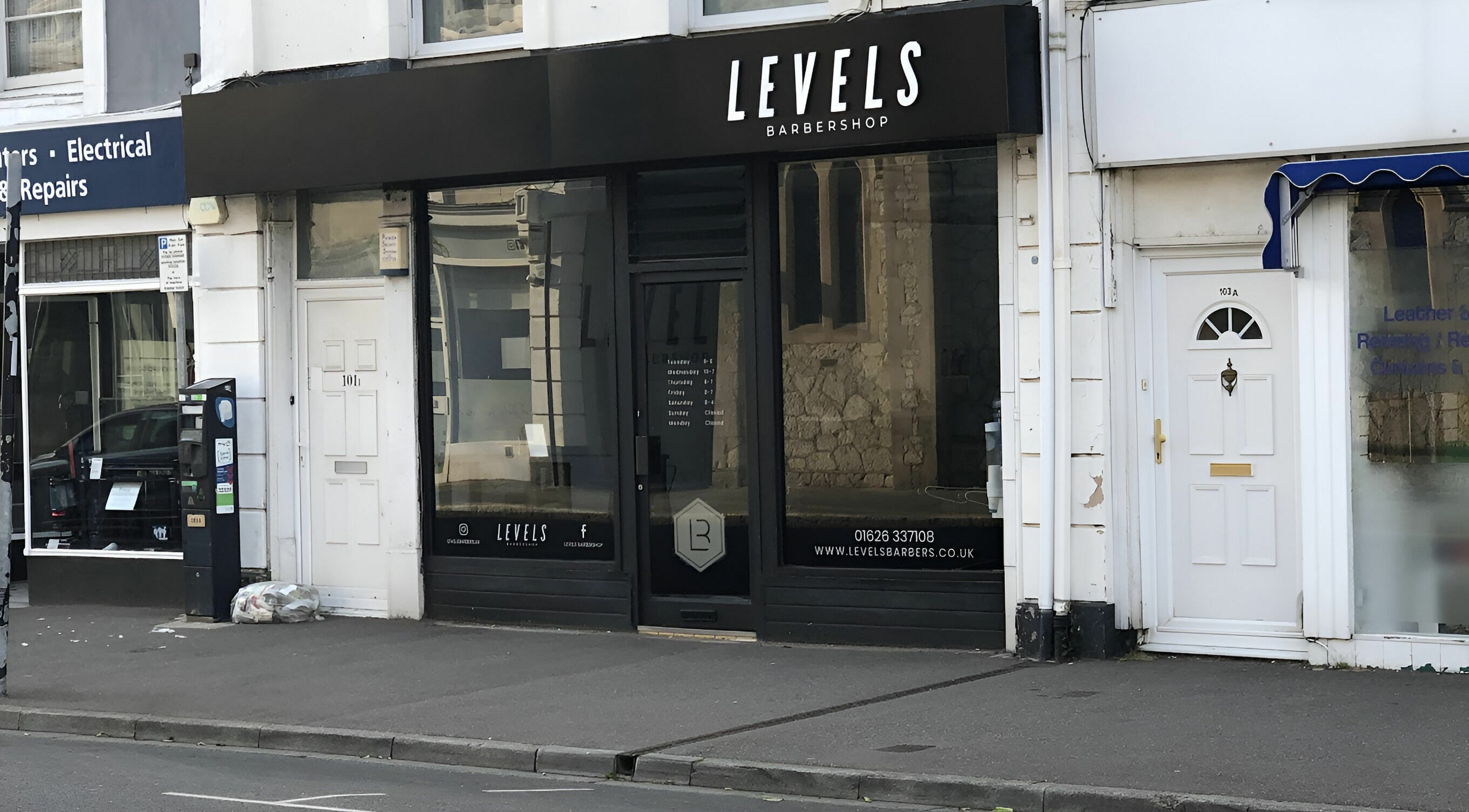 Front view of Levels Mens Grooming in Newton Abbot, England, GB showing modern barbershop facade.