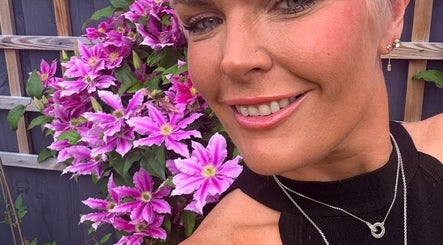 Vibrant garden flowers backdrop at Meraki Beauty and Aesthetics, Penwortham, England, GB.