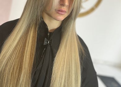 Long, sleek hair extensions by Ash Lawrence Hair Extensions in Prestwich, England, GB.
