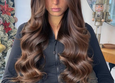 Lush brown hair extensions at Ash Lawrence Hair Extensions, Prestwich, England, GB, showcasing holiday decor.