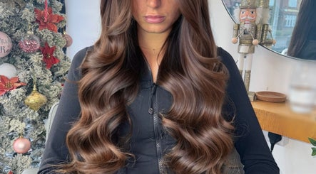 Lush brown hair extensions at Ash Lawrence Hair Extensions, Prestwich, England, GB, showcasing holiday decor.