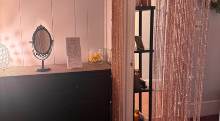 Cozy decor at LSL Lash Studio Red Bank in Red Bank, New Jersey, US, featuring mirror and ambient lighting.