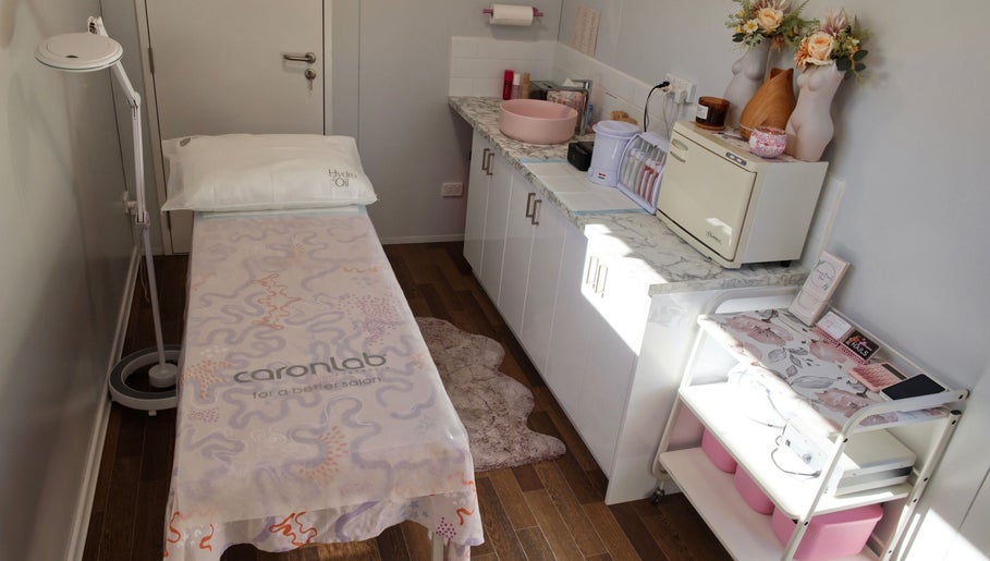 Treatment room at Breanna’s Beauty Room, Toormina, New South Wales, AU featuring a comfortable massage table and decor.