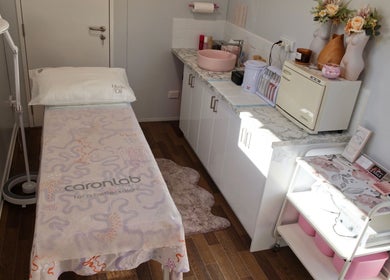 Treatment room at Breanna’s Beauty Room, Toormina, New South Wales, AU featuring a comfortable massage table and decor.