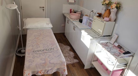 Treatment room at Breanna’s Beauty Room, Toormina, New South Wales, AU featuring a comfortable massage table and decor.